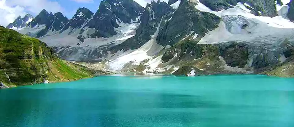 Alpather lake near the snow covered mountains
