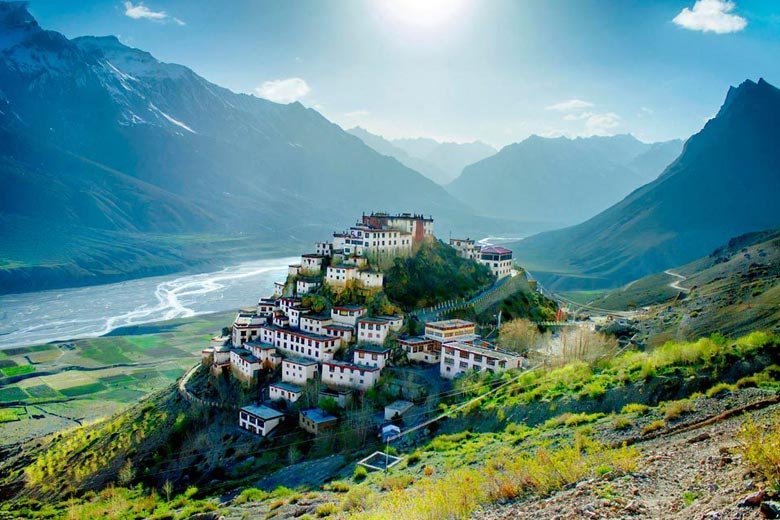 Scenic view of Zanskar Valley with a monastery perched on a hill surrounded by mountains