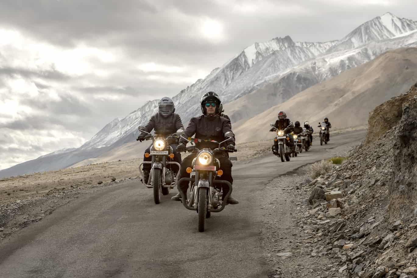 Group of bikers riding on a mountain road in Ladakh