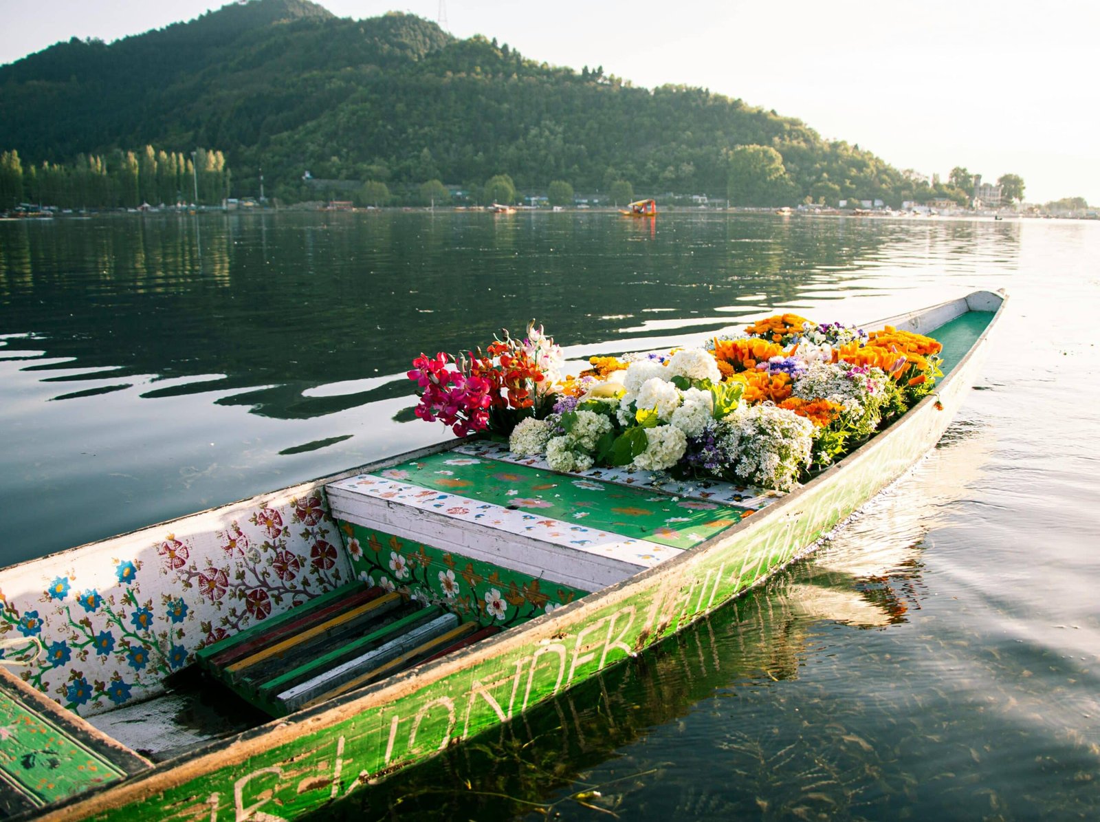 Flower-filled Shikara on Dal Lake in Kashmir