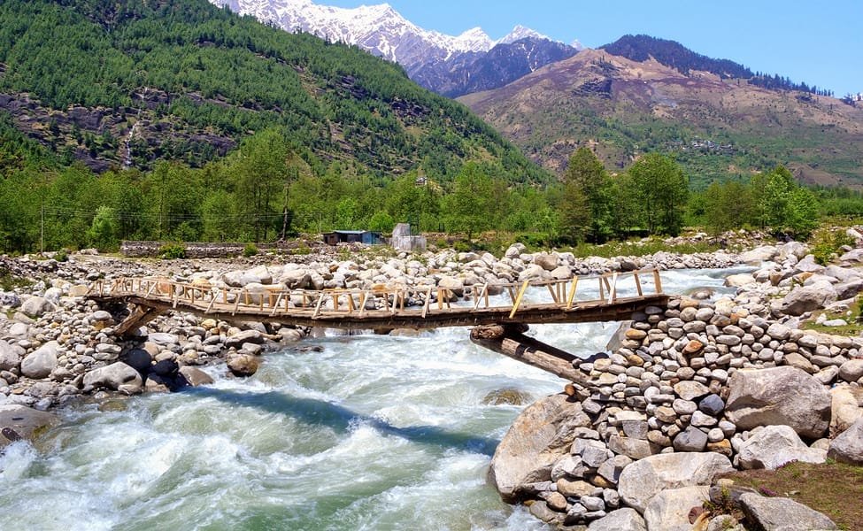 Wooden bridge over a river in a Gulaba village