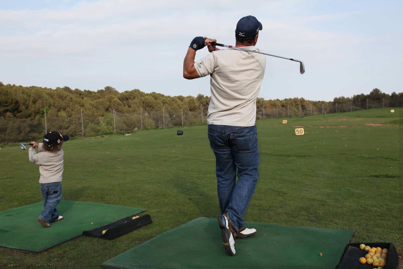 child and father playing golf at Gulmarg Golf Course​
