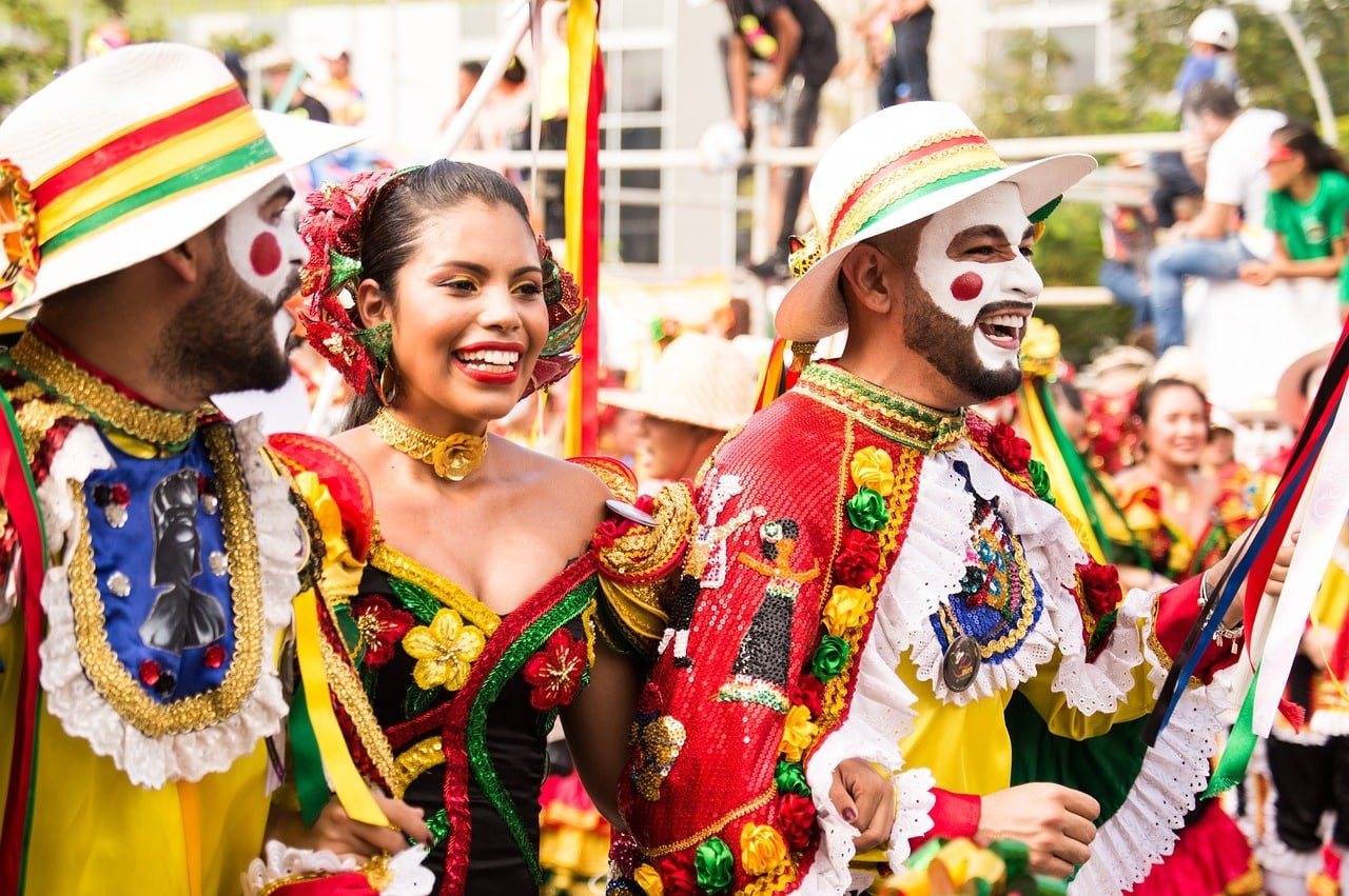 People in colorful traditional costumes celebrating at a lively street festival in ladakh