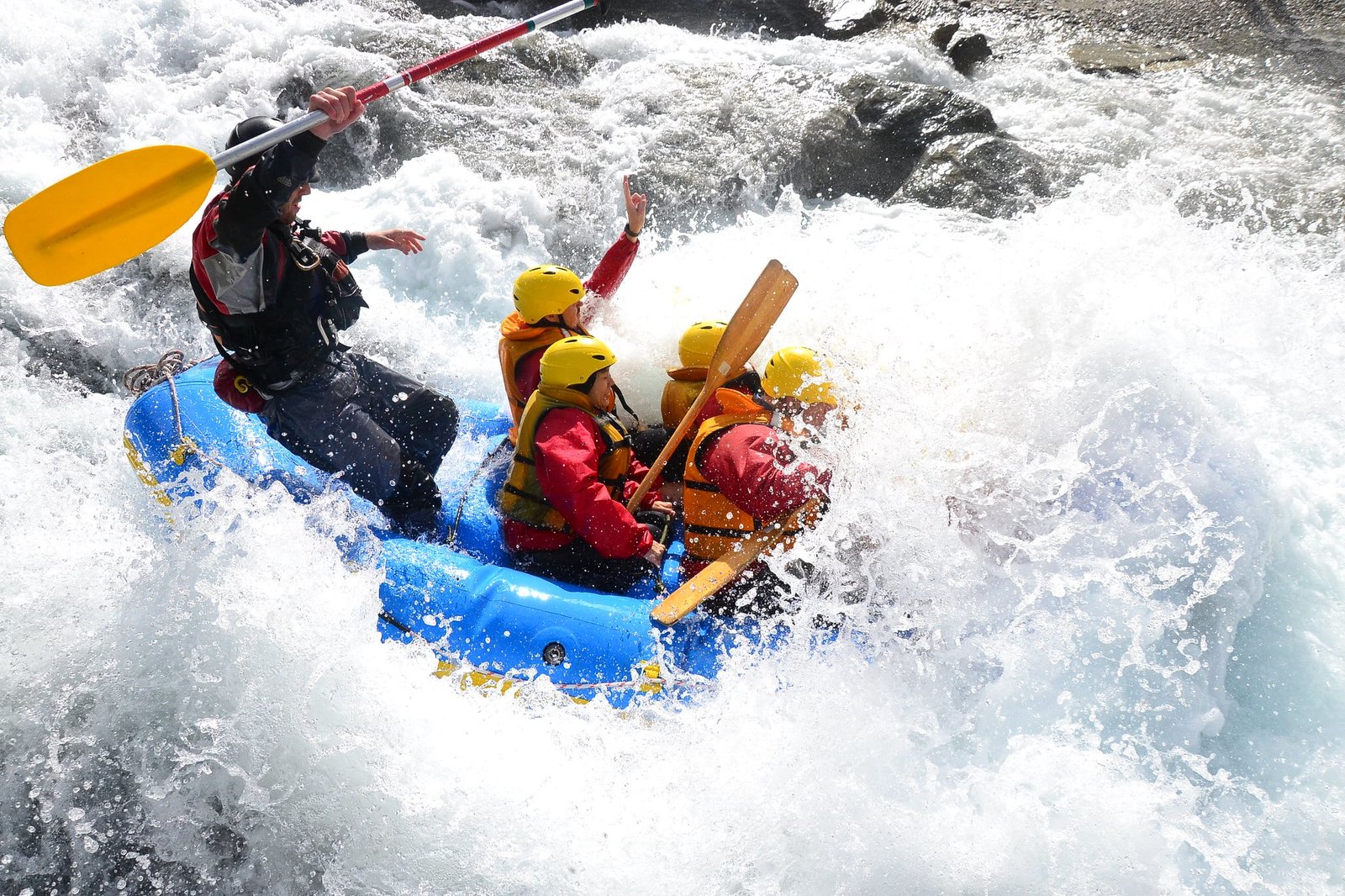white-water rafting through rough river rapids in kashmir