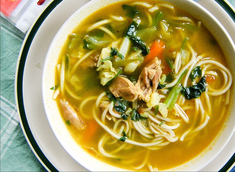 A bowl of thukpa noodle soup with vegetables and pieces of meat is a ladakhi cuisine