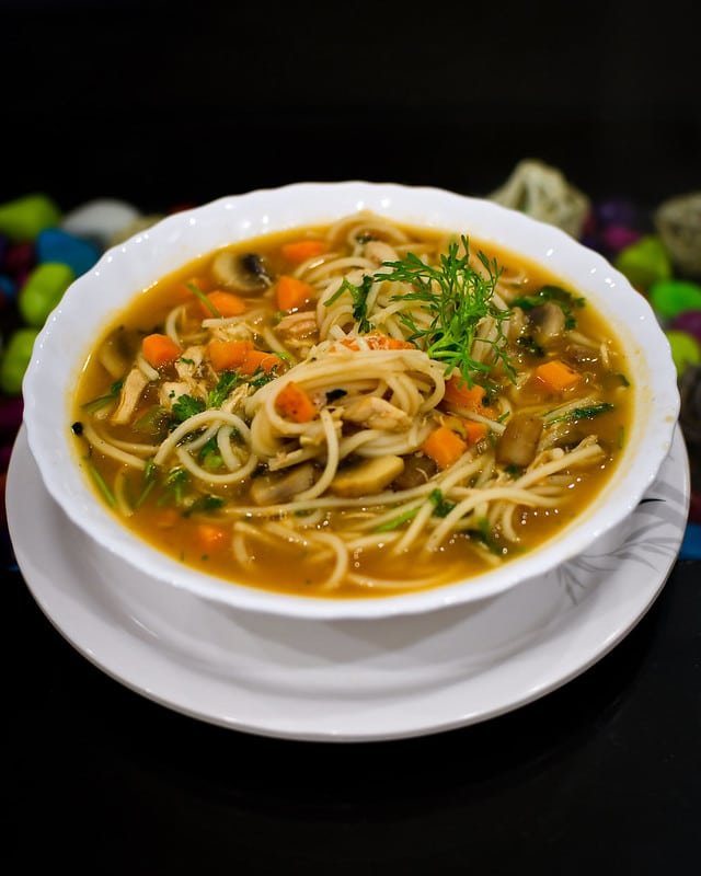 Bowl of hot thukpa with noodles and vegetables