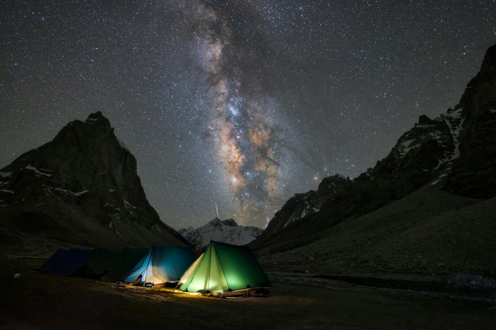 Glowing tents under a star-filled sky with the Milky Way visible at Hanle Dark Sky Reserve