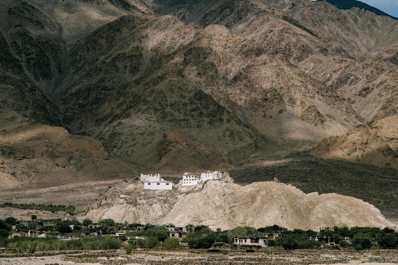Basgo Monastery on a rocky hill with barren mountains in Ladakh during May