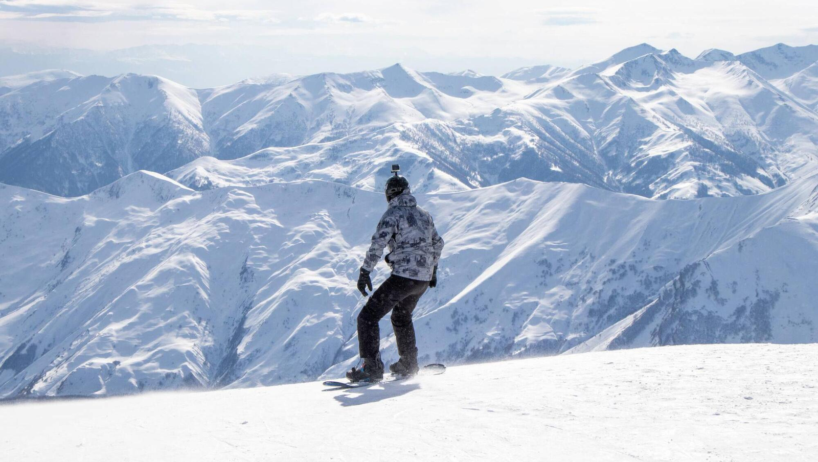 Snowboarding in the snowy mountains during skiing and snowboarding in Kashmir